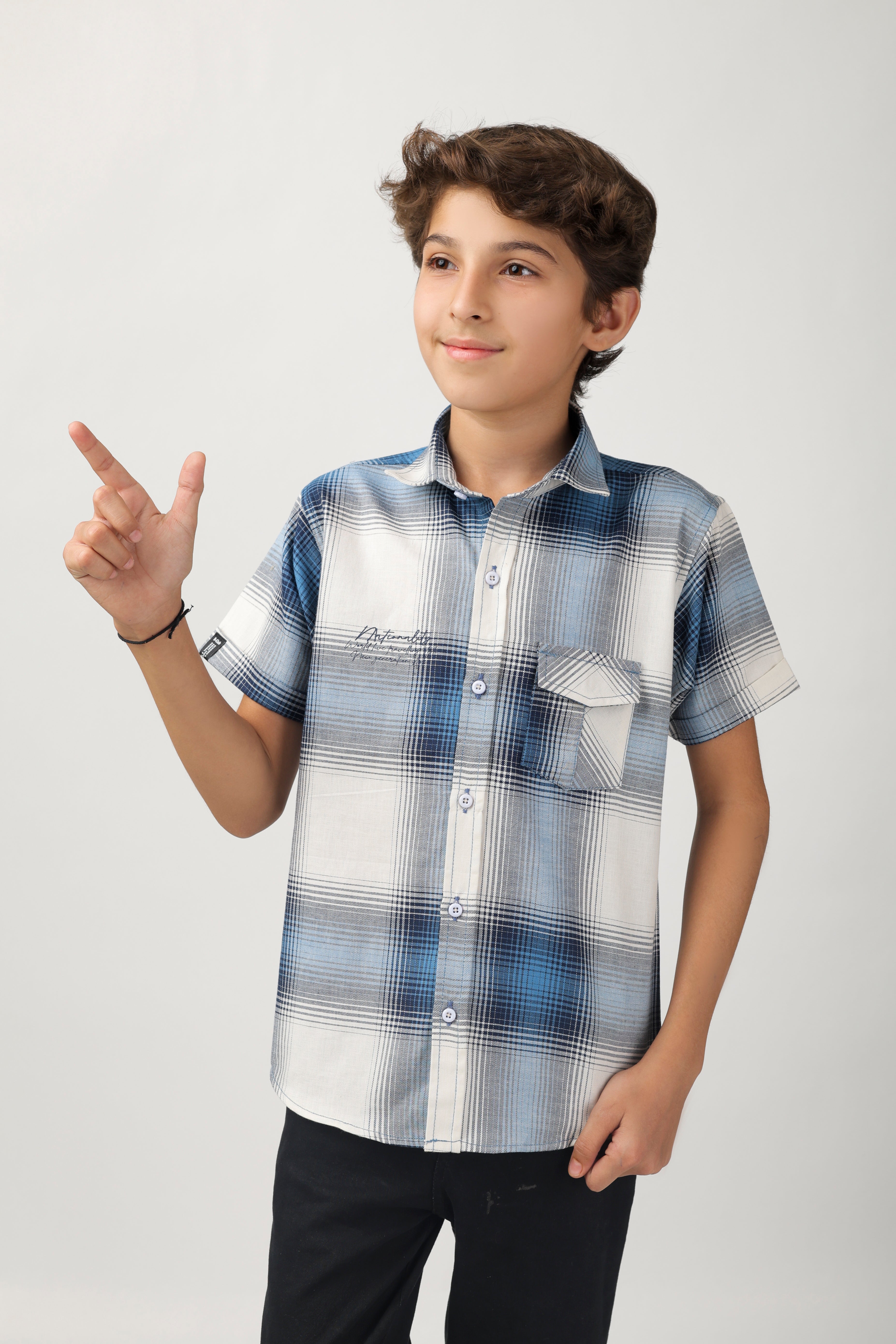 Boys' short-sleeve shirt features a classic blue and white checks