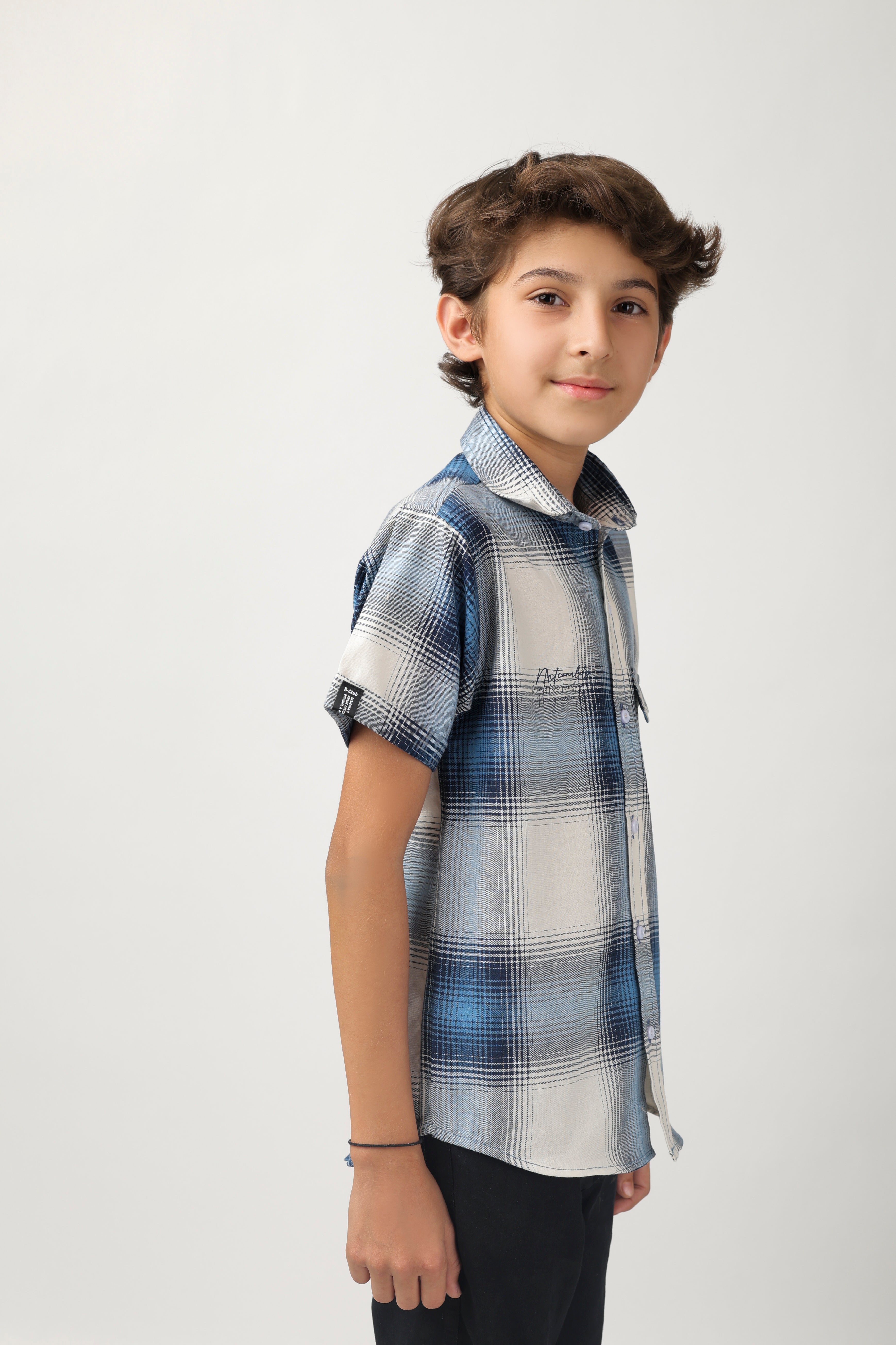 Boys' short-sleeve shirt features a classic blue and white checks