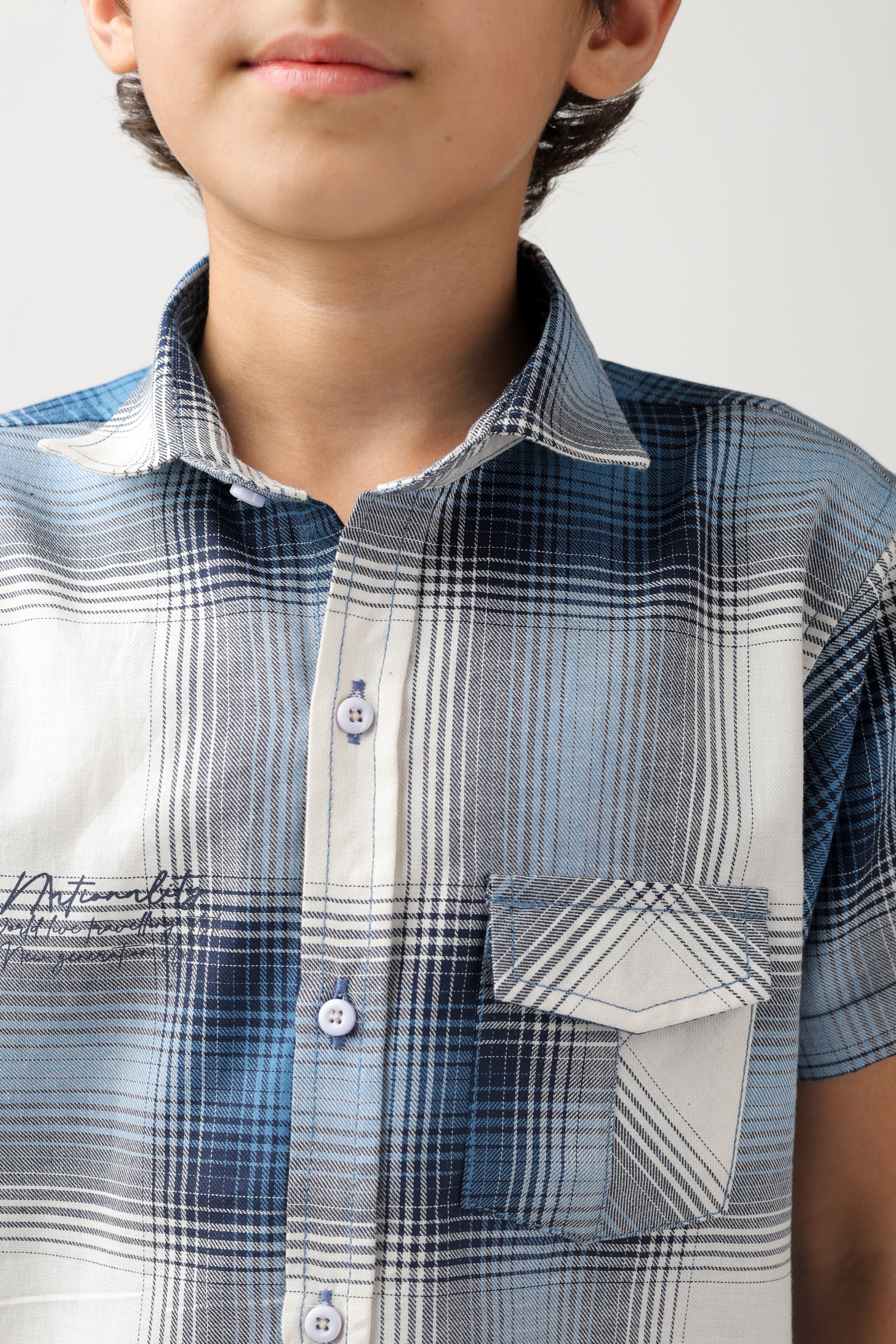 Boys' short-sleeve shirt features a classic blue and white checks