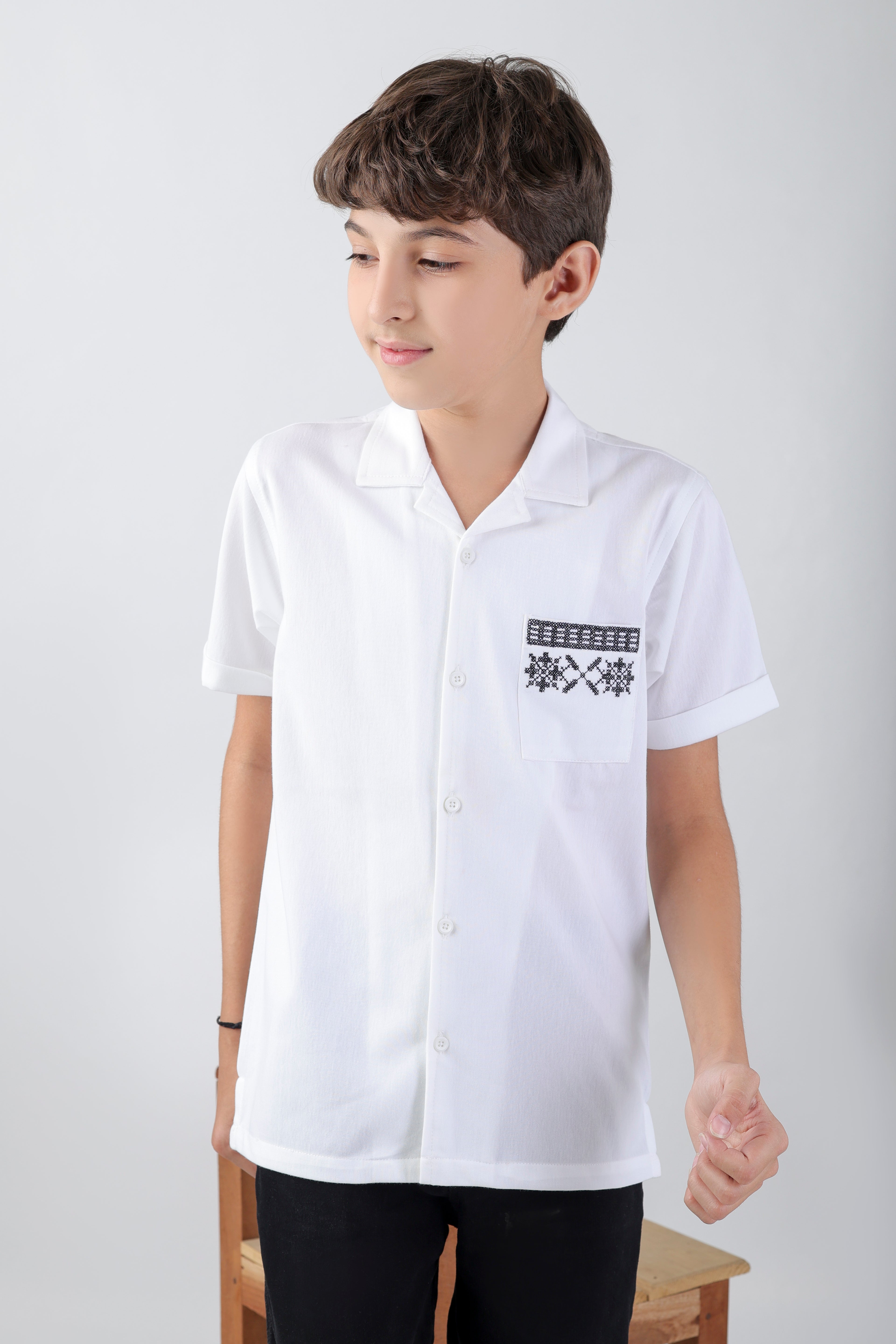 Crisp white boys' shirt with short-sleeve an embroidery