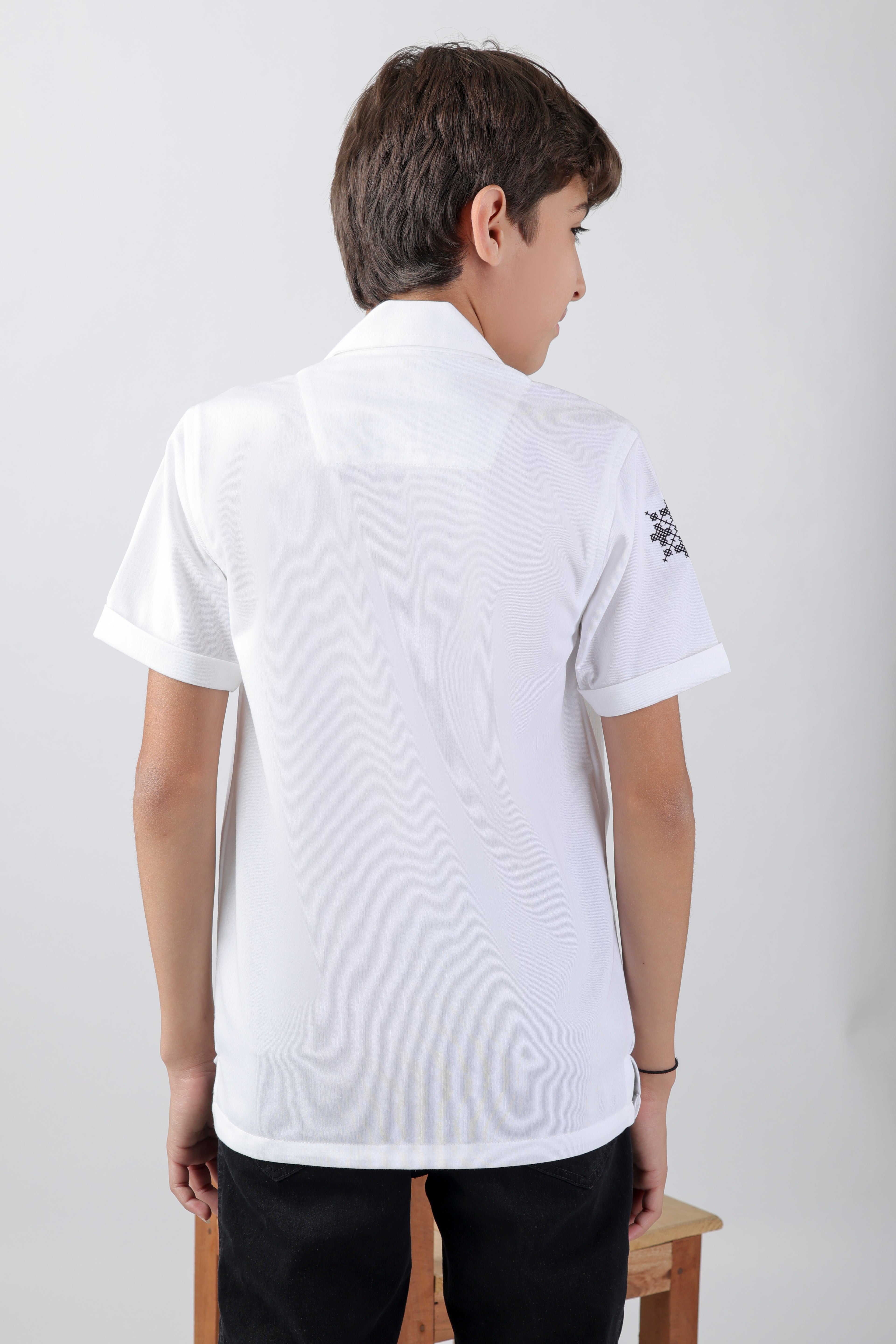 Crisp white boys' shirt with short-sleeve an embroidery