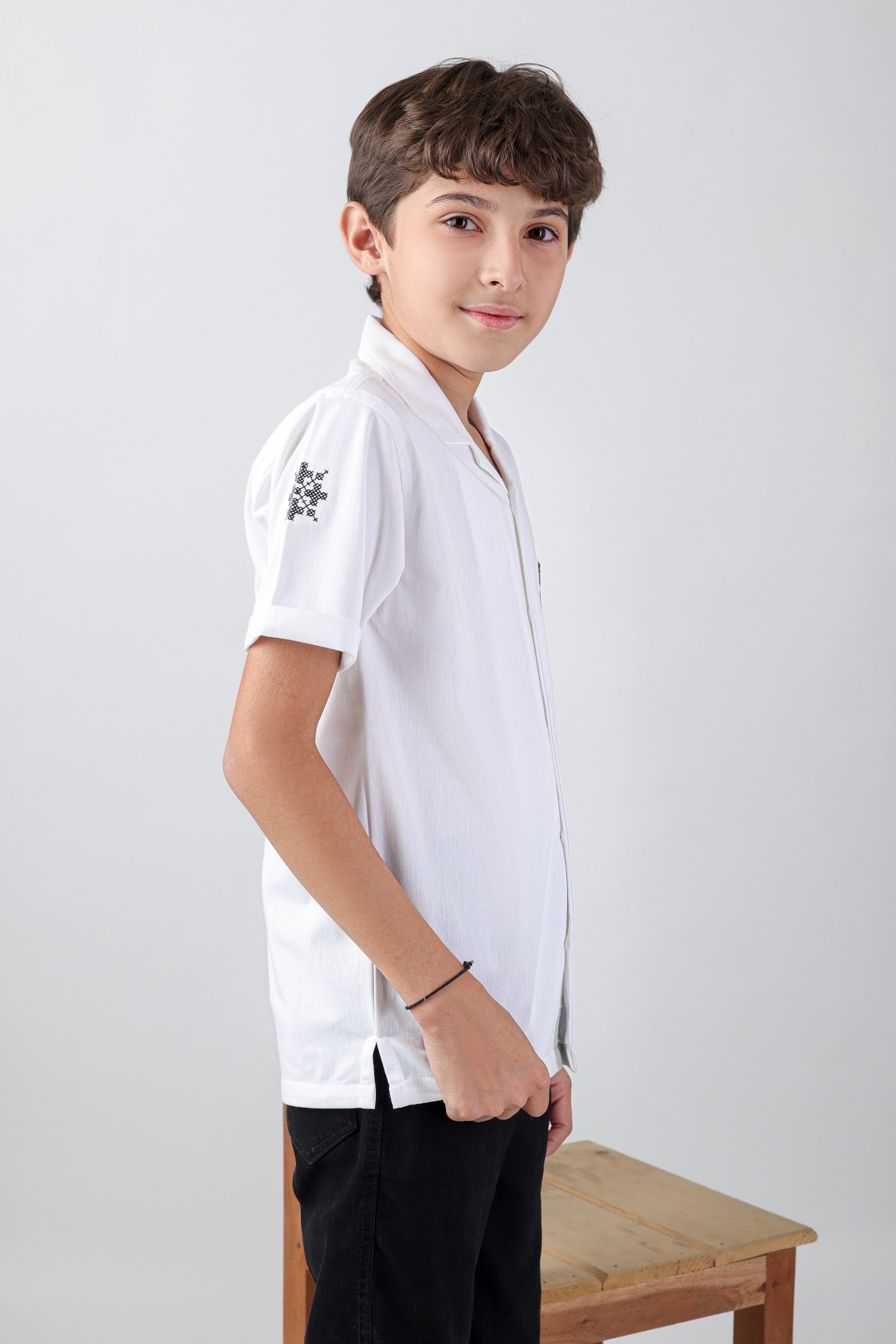 Crisp white boys' shirt with short-sleeve an embroidery