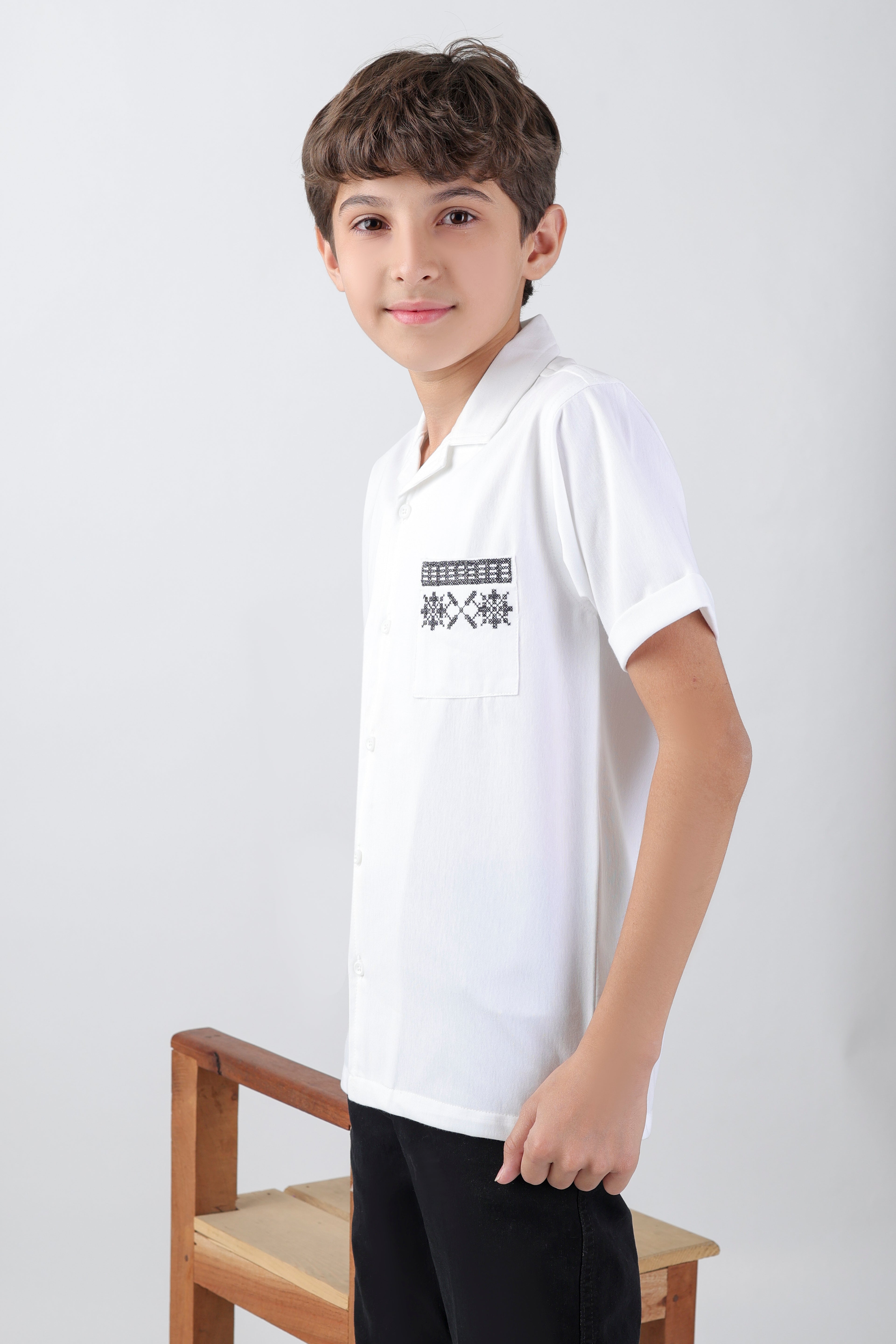 Crisp white boys' shirt with short-sleeve an embroidery