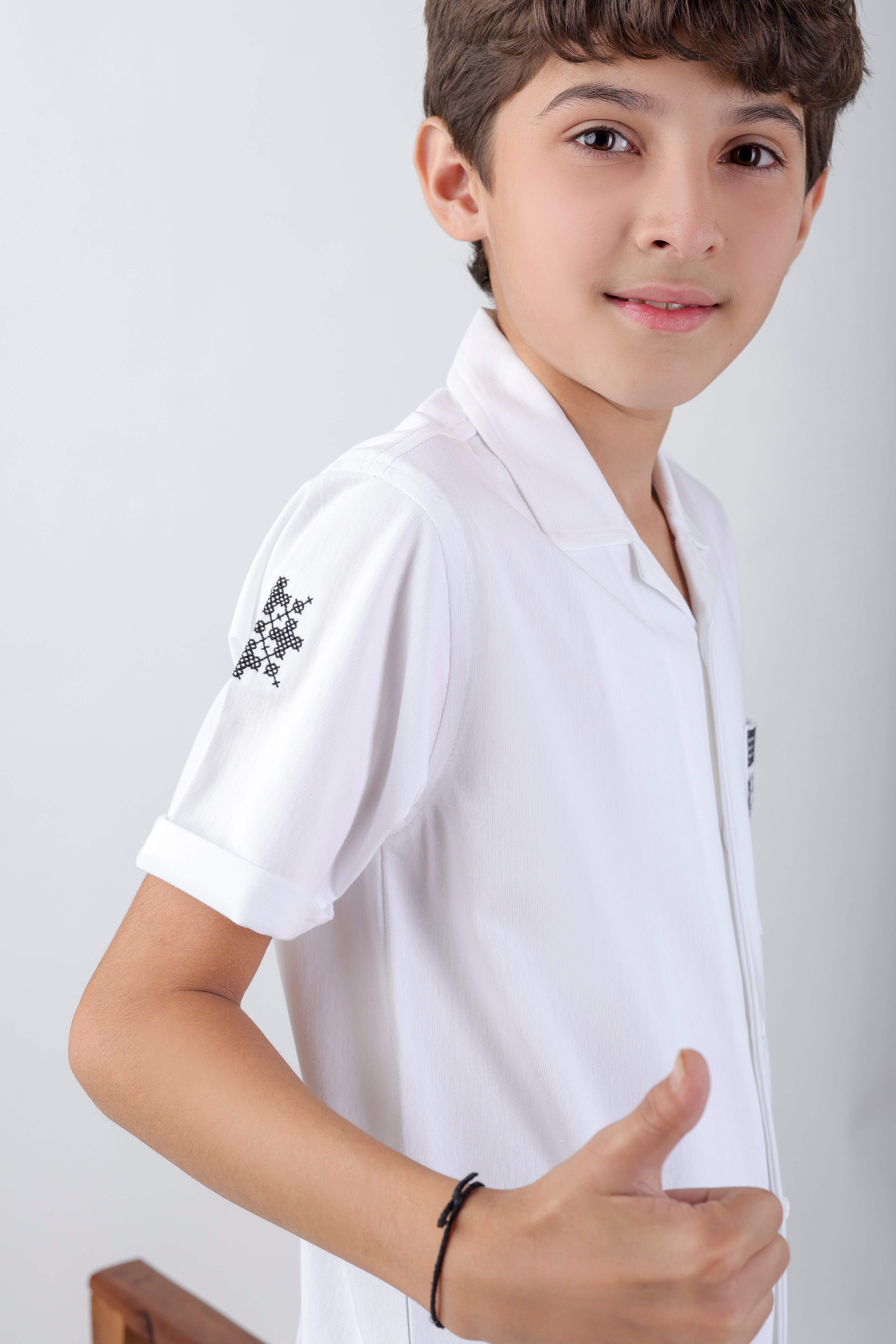 Crisp white boys' shirt with short-sleeve an embroidery