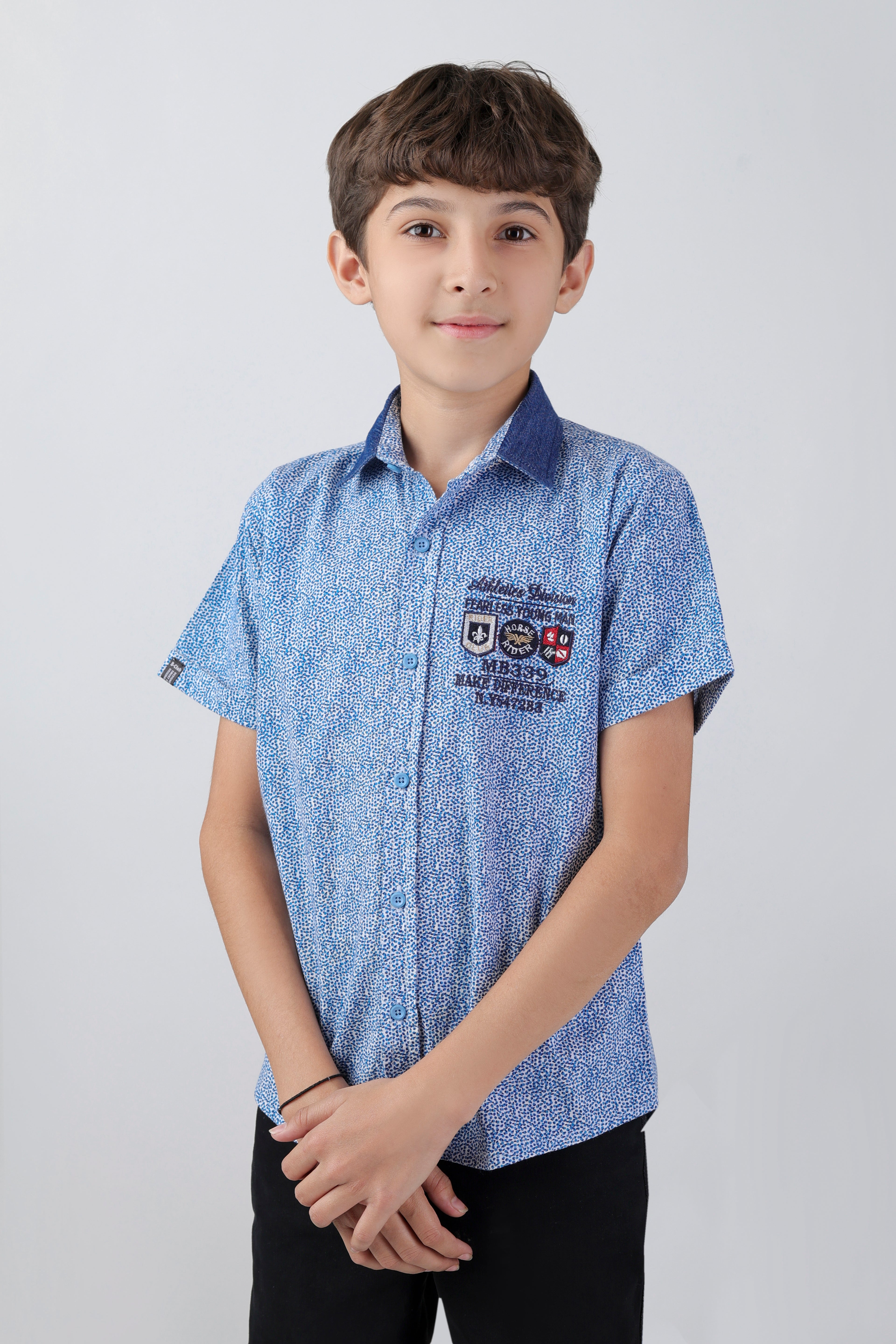 Boys' short sleeve shirt with a multi-badge embroidery