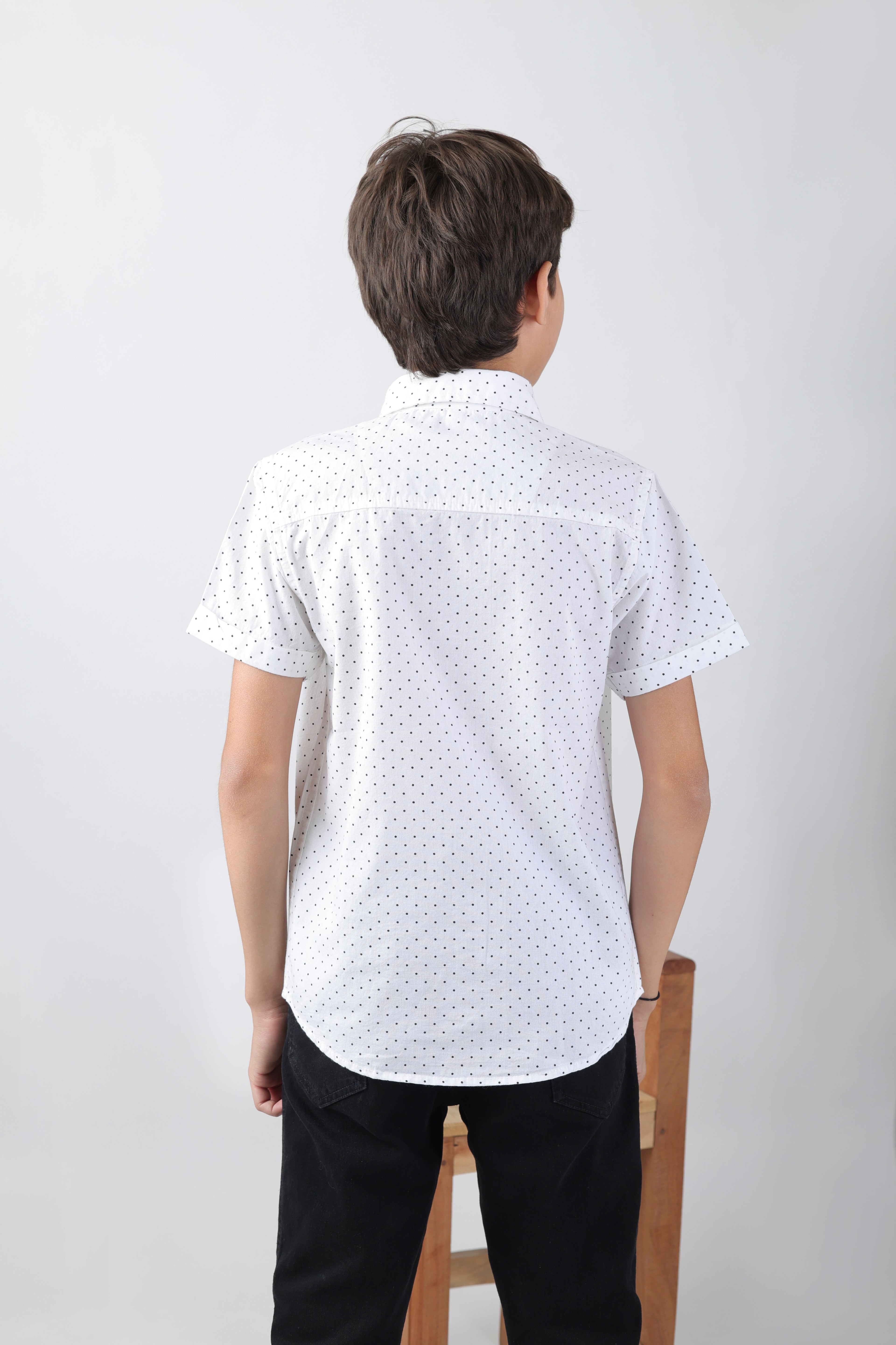 Crisp white short sleeve shirt with a polka-dot base and an embroidery patch