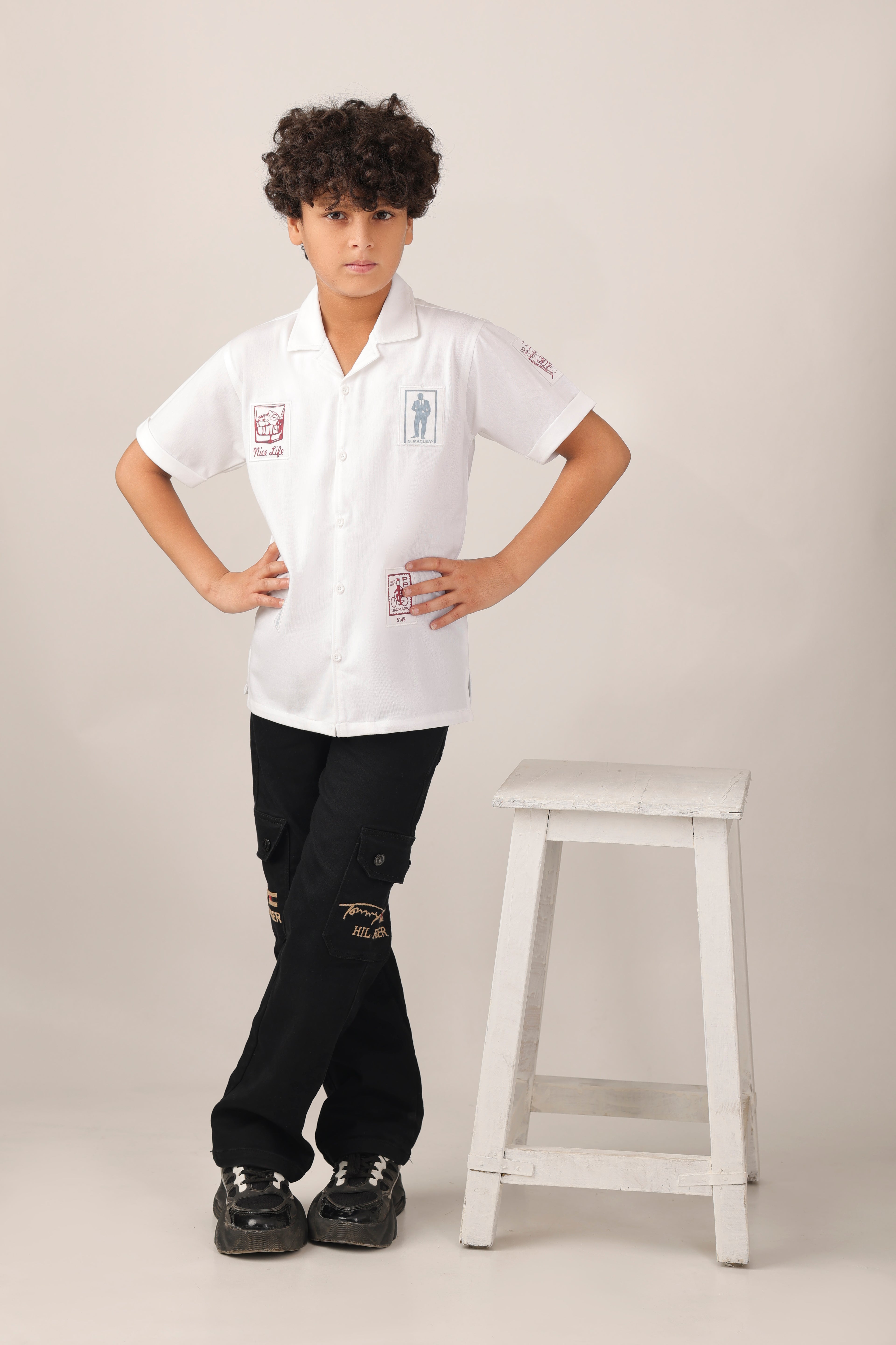 Crisp white short-sleeve design with camp collar