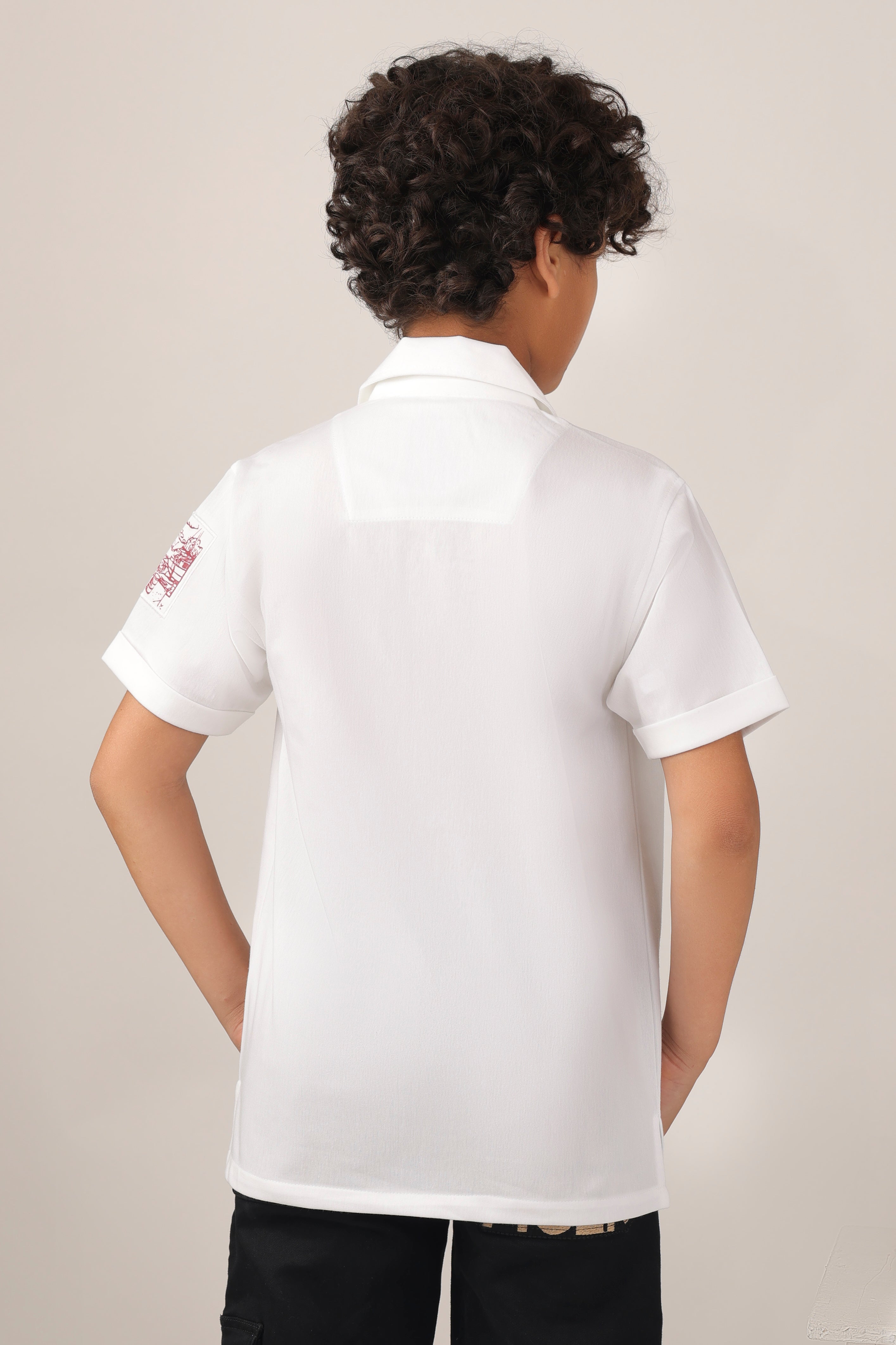 Crisp white short-sleeve design with camp collar