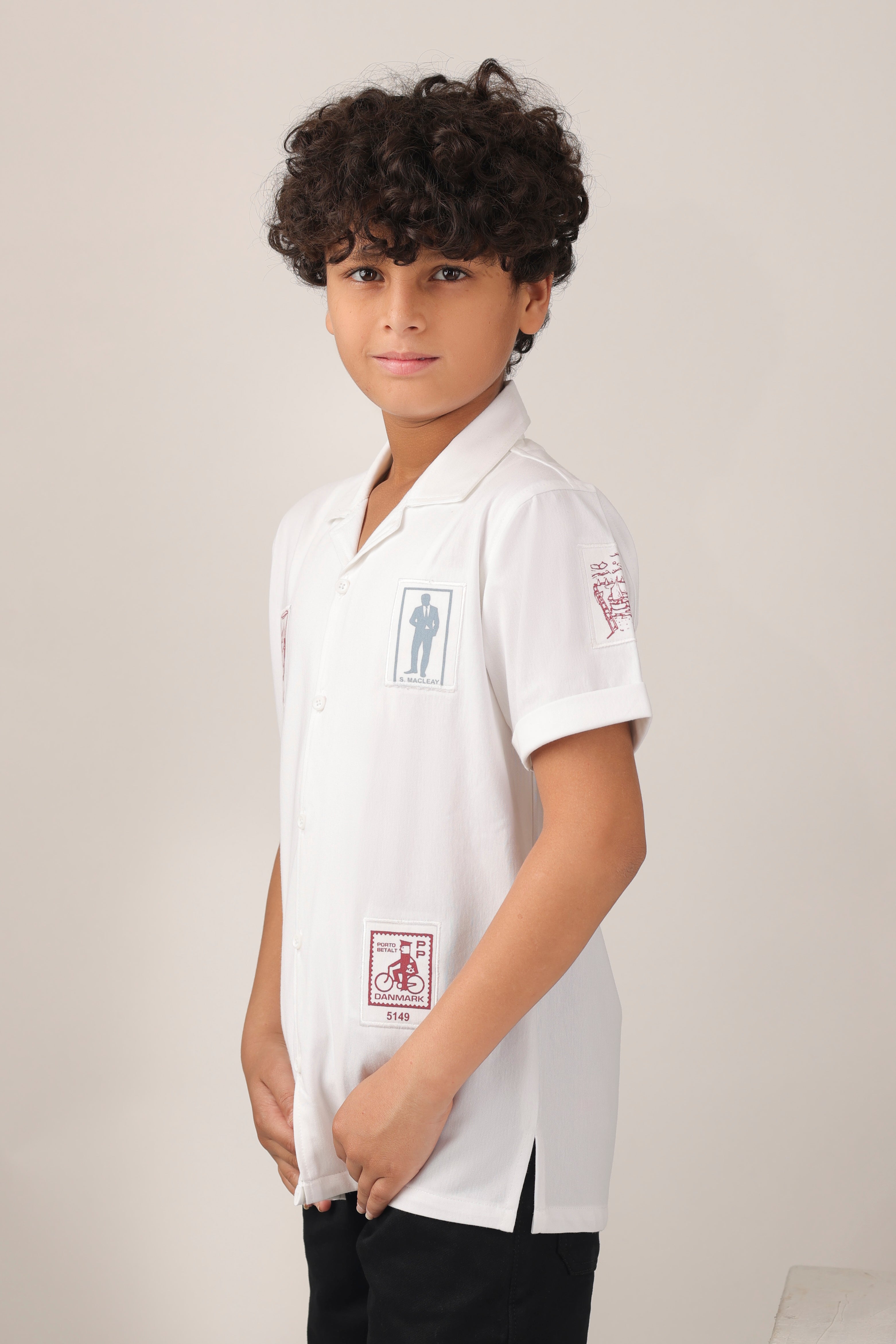 Crisp white short-sleeve design with camp collar