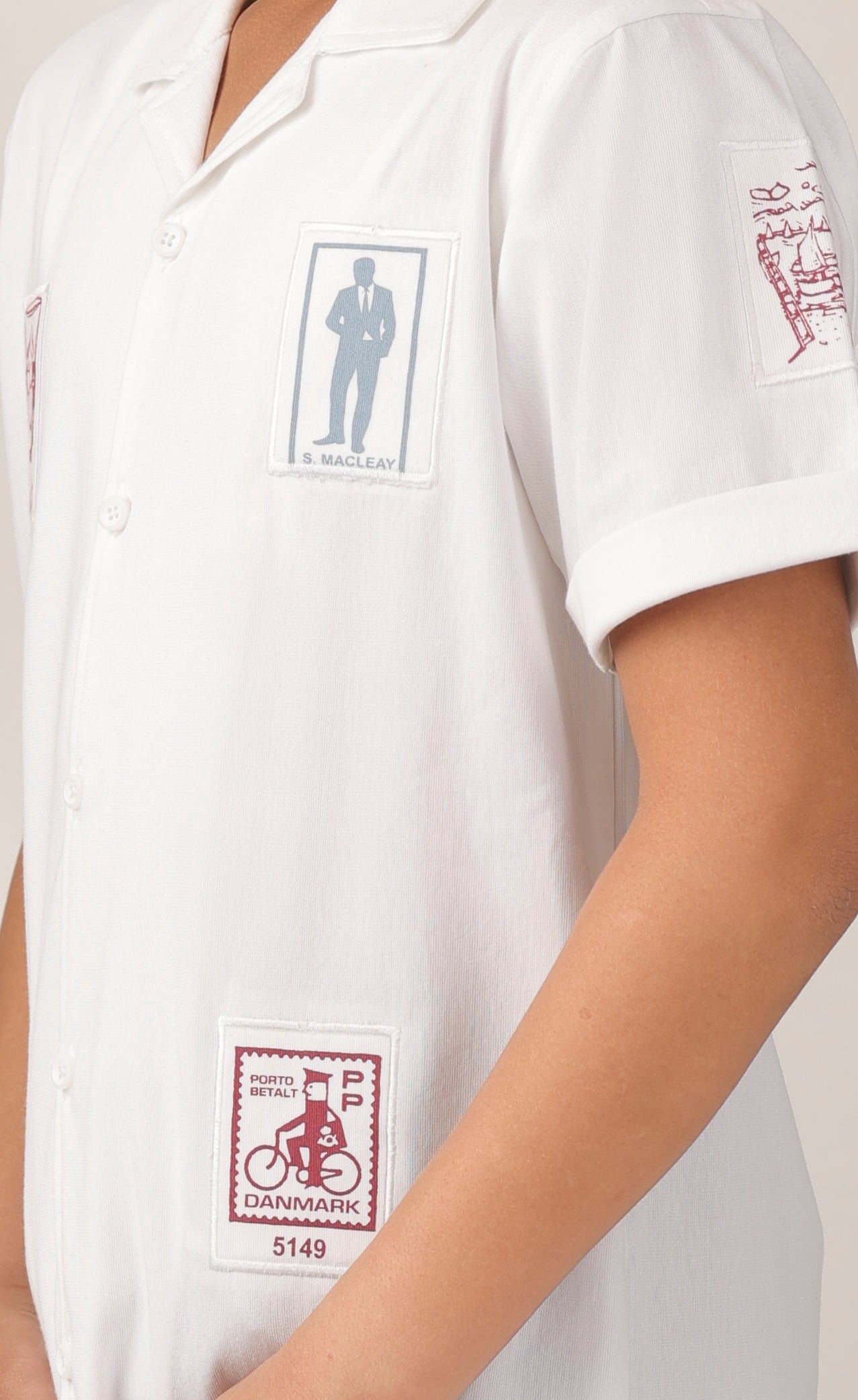 Crisp white short-sleeve design with camp collar
