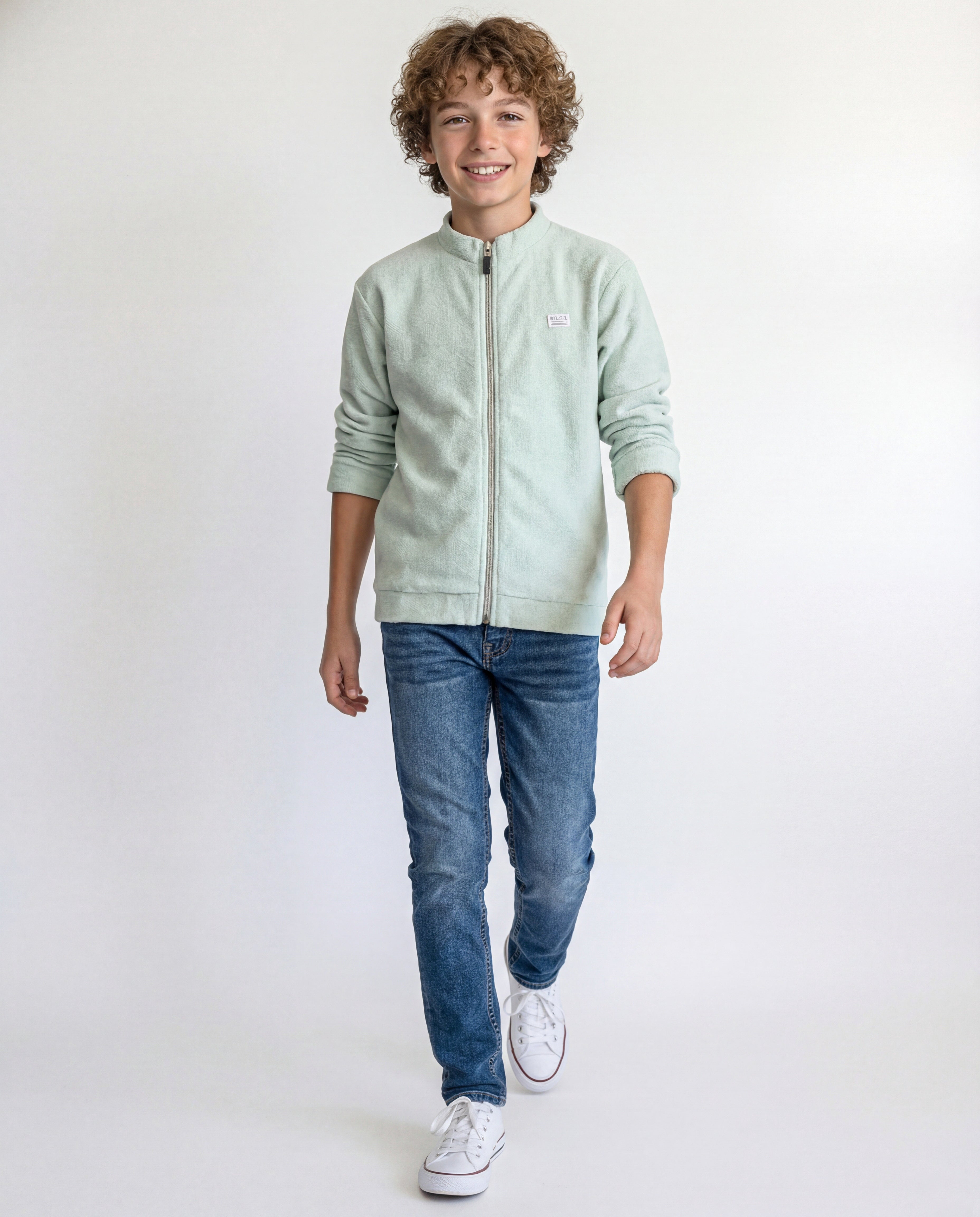 Boys' jacket with a full zip front and stand collar.