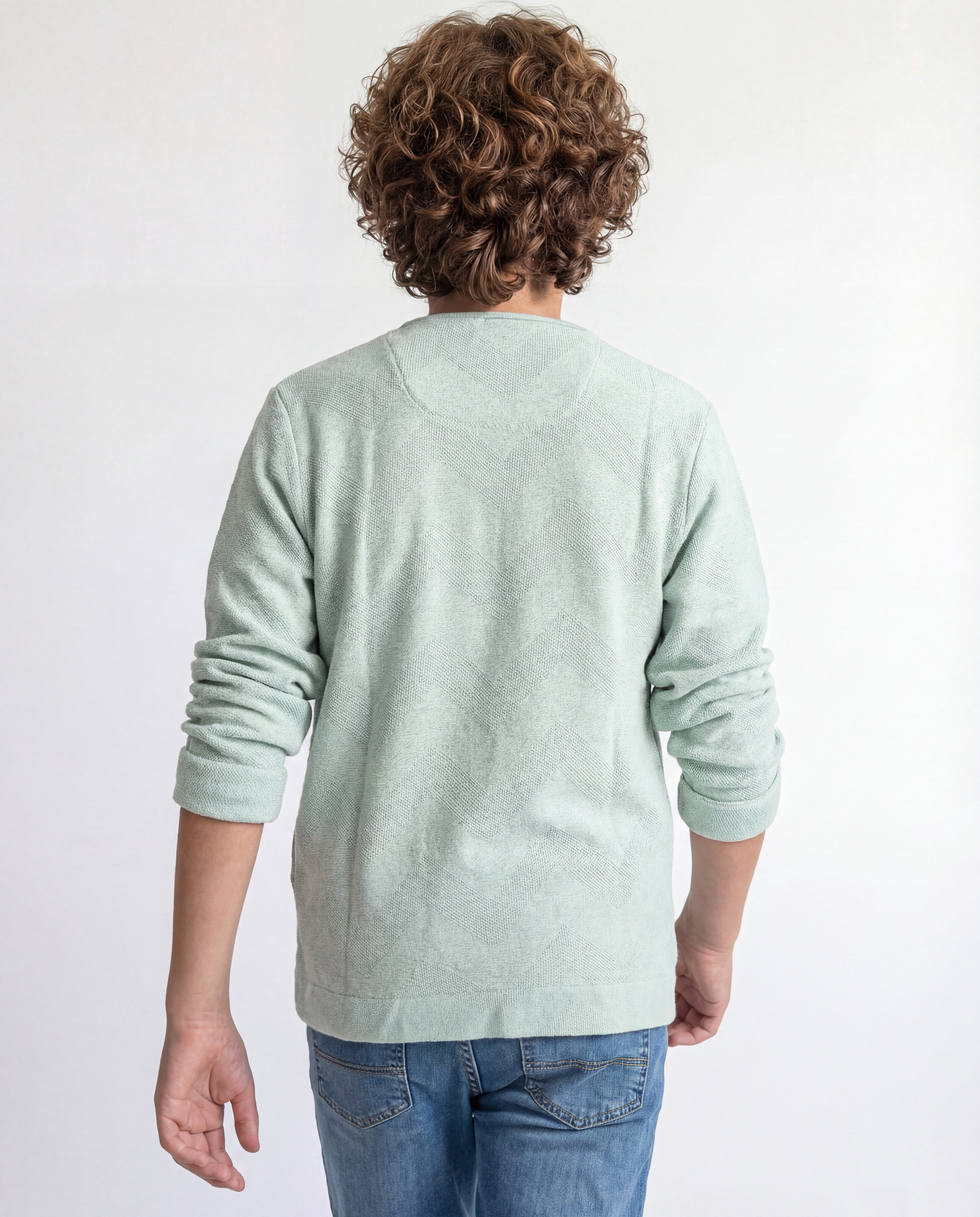 Boys' jacket with a full zip front and stand collar.