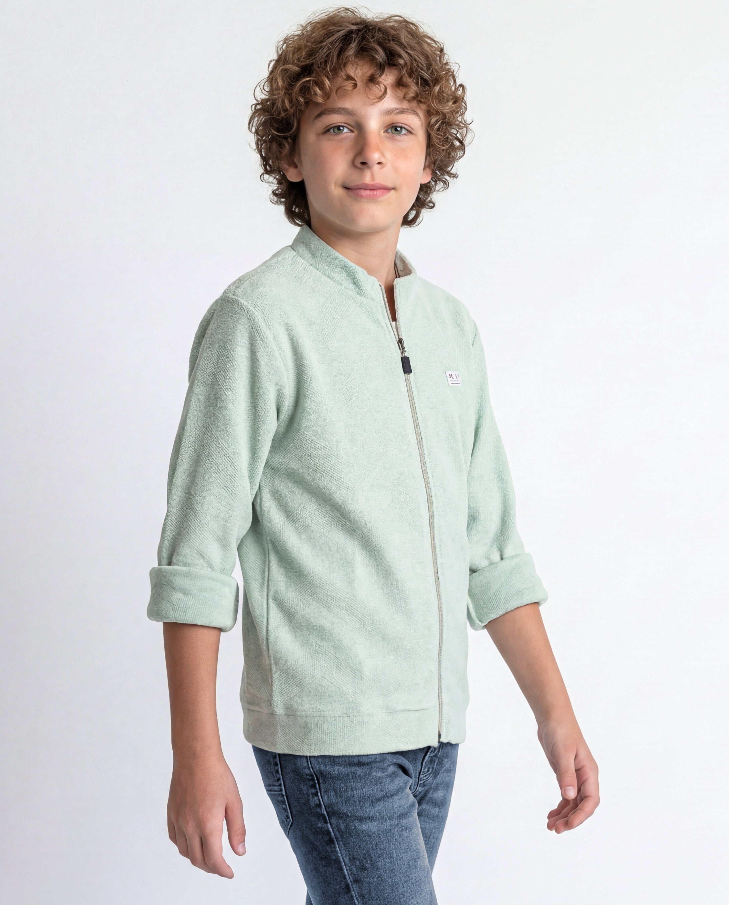 Boys' jacket with a full zip front and stand collar.