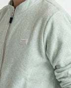 Boys' jacket with a full zip front and stand collar.