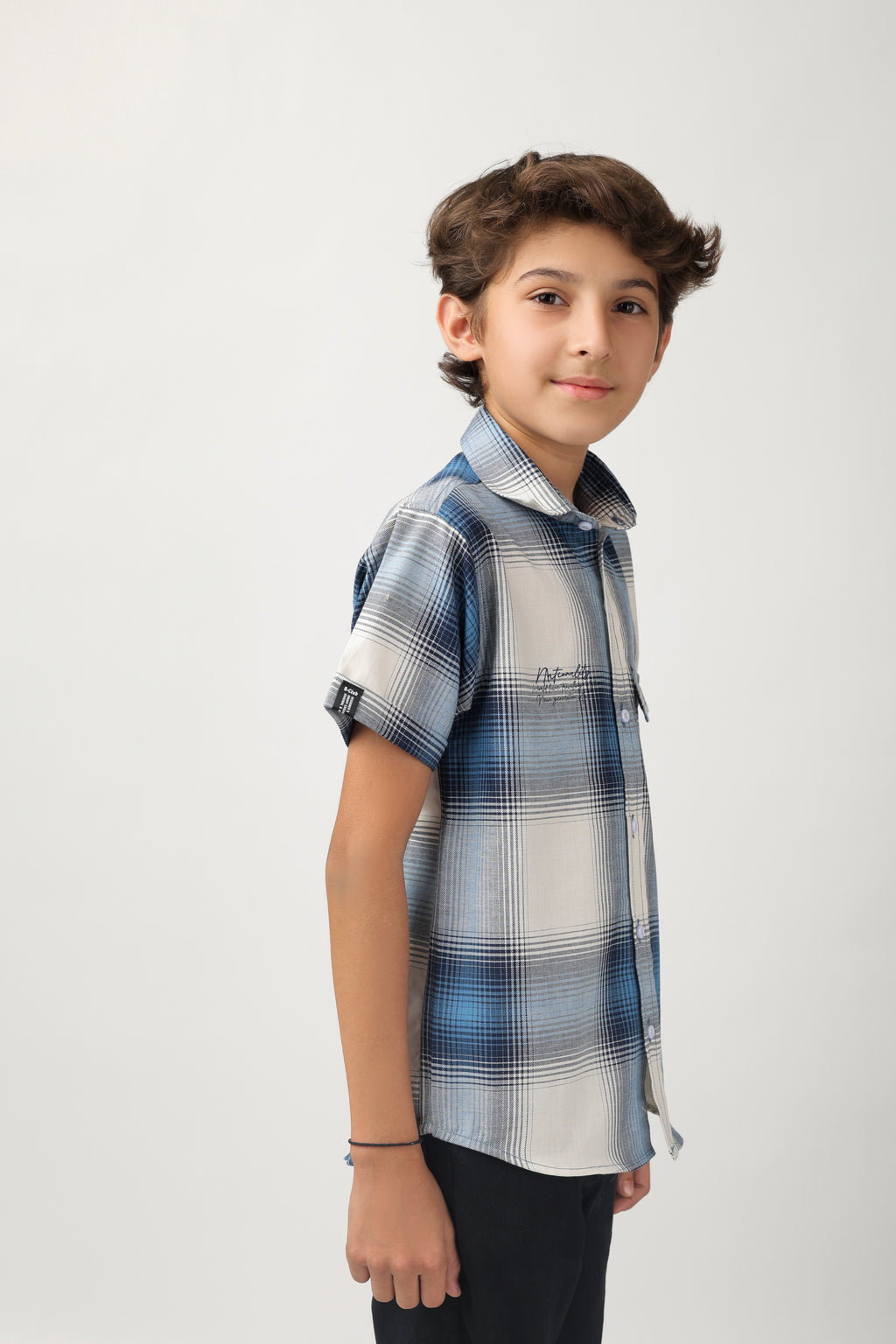 Boys' short-sleeve shirt features a classic blue and white checks