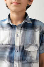 Boys' short-sleeve shirt features a classic blue and white checks