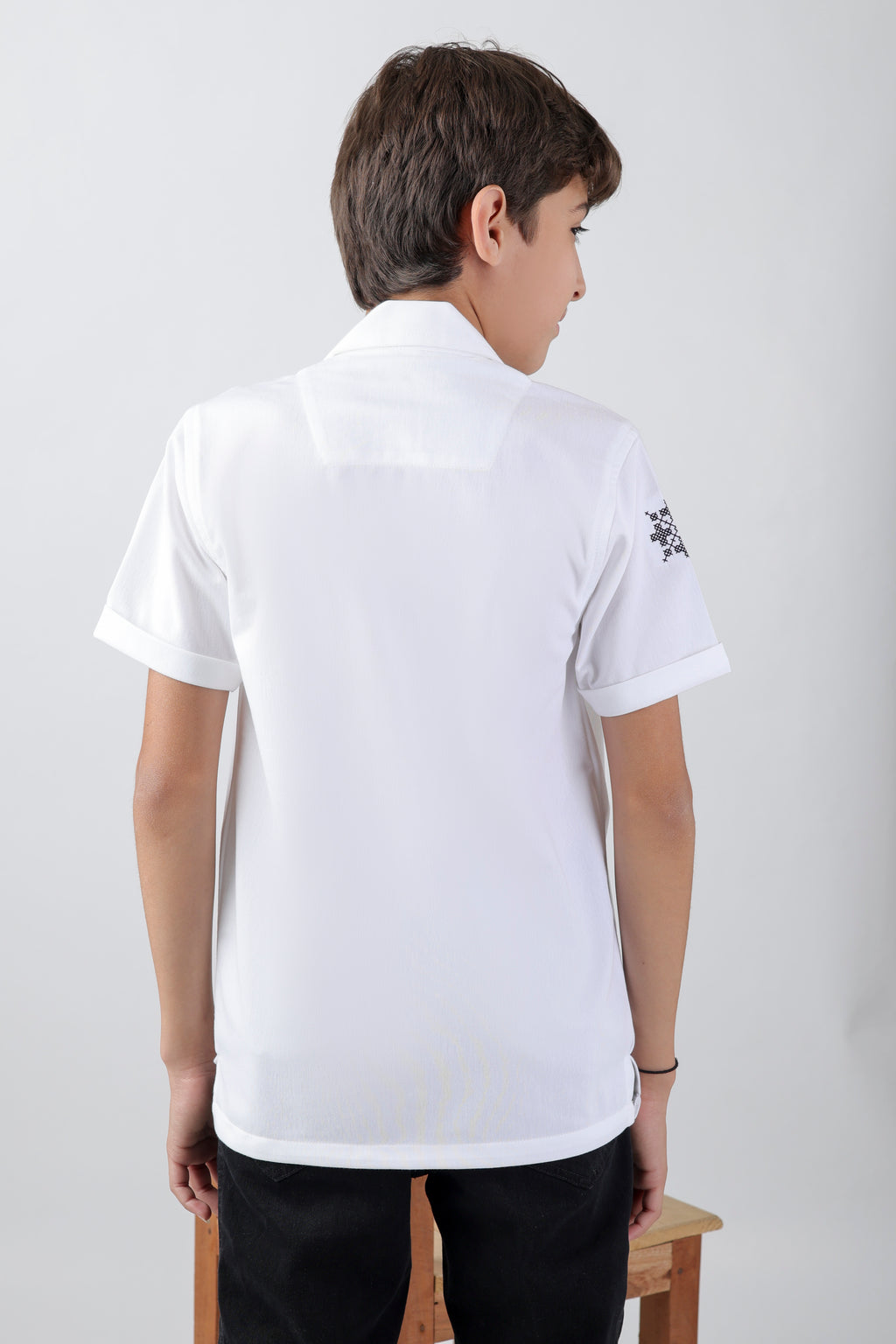 Crisp white boys' shirt with short-sleeve an embroidery