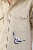 Boys' shirt with 2 flap pockets and an embroidered detail