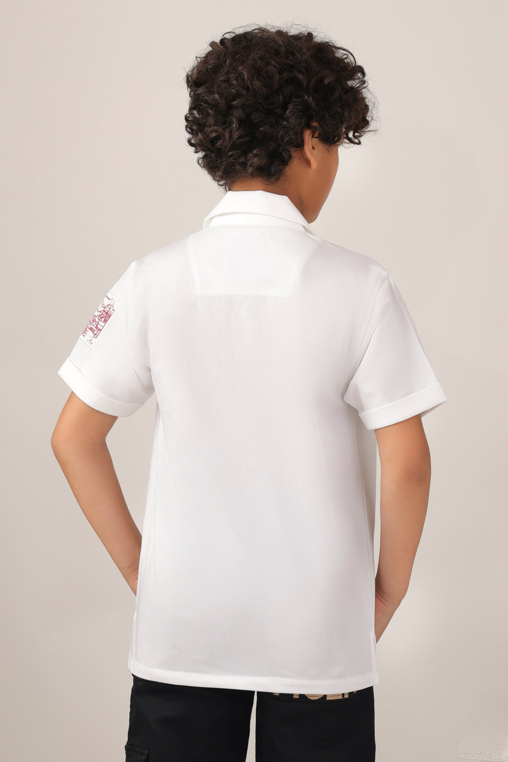 Crisp white short-sleeve design with camp collar