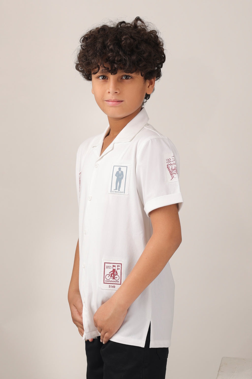 Crisp white short-sleeve design with camp collar